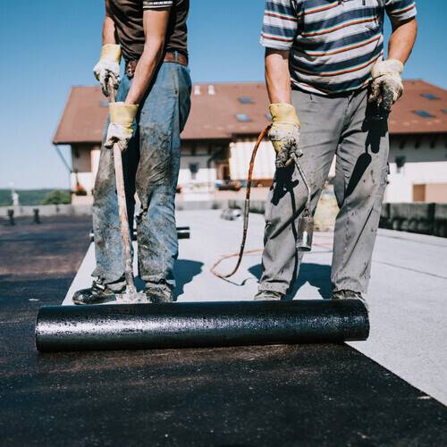 workers on a commercial roof
