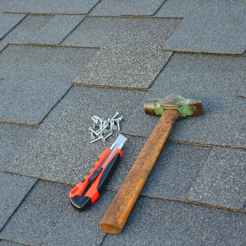 hammer and nails on shingles